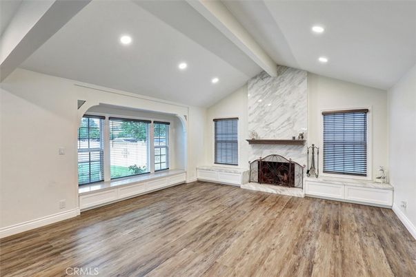 Empty room, Fireplace, Interior, Marble Walls, Recessed Lighting, Wood Texture Flooring