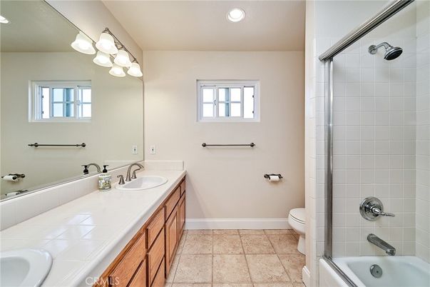 Bathroom, Dual Sink Vanities, Glass Shower, Interior, Recessed Lighting, Tile Countertops