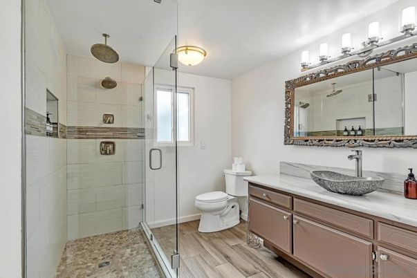 Bathroom, Dual Sink Vanities, Glass Shower, Interior, Wood Texture Flooring