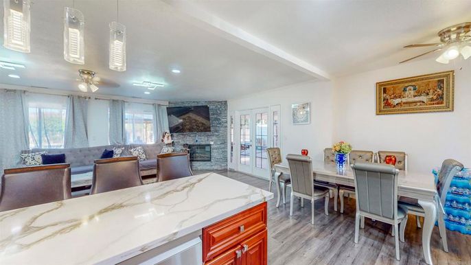 Dining room, Fireplace, Interior, Recessed Lighting, Stone Walls, Wood Texture Flooring