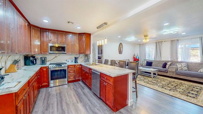 Dining room, Interior, Kitchen, Living room, Pendant Lights, Recessed Lighting, Stainless Steel Appliances, Wood Texture Flooring