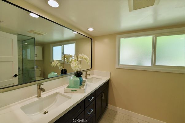 Bathroom, Dual Sink Vanities, Glass Shower, Interior, Recessed Lighting, Wood Texture Flooring