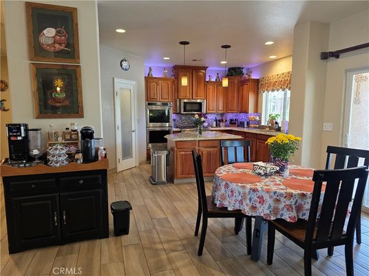 Dining room, Interior, Kitchen, Pendant Lights, Recessed Lighting, Stainless Steel Appliances, Wood Texture Flooring