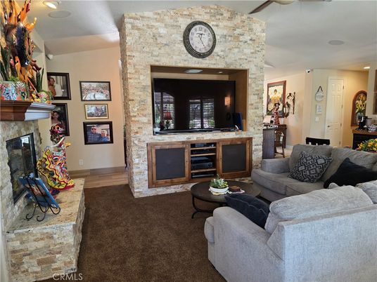 Fireplace, Interior, Living room, Recessed Lighting, Stone Walls, Wood Texture Flooring