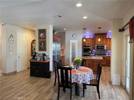Dining room, Interior, Kitchen, Pendant Lights, Recessed Lighting, Stainless Steel Appliances, Wood Texture Flooring