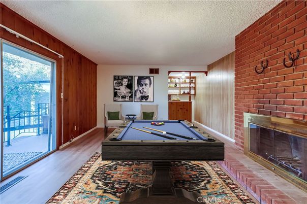 Billiard Table, Fireplace, Game Room, Interior, Stone Walls, Wood Texture Flooring, Wooden Walls