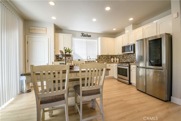 Dining room, Interior, Kitchen, Recessed Lighting, Stainless Steel Appliances, Wood Texture Flooring
