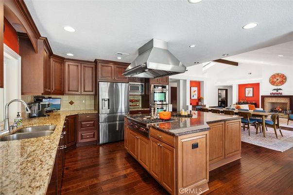 Dining room, Fireplace, Interior, Kitchen, Recessed Lighting, Stainless Steel Appliances, Wood Texture Flooring