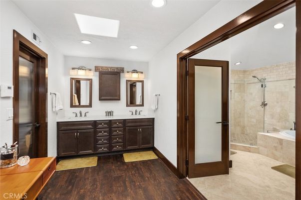 Bathroom, Dual Sink Vanities, Glass Shower, Interior, Recessed Lighting, Wood Texture Flooring