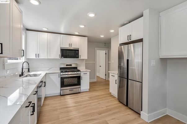 Interior, Kitchen, Recessed Lighting, Stainless Steel Appliances, Wood Texture Flooring