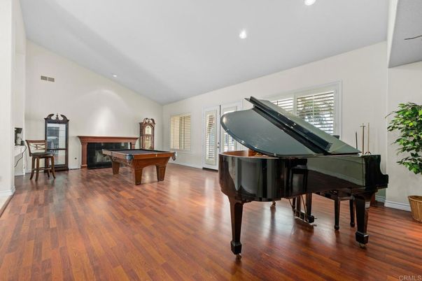 Billiard Table, Fireplace, Game Room, Interior, Piano, Recessed Lighting, Wood Texture Flooring