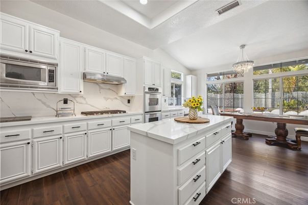 Chandelier, Interior, Kitchen, Marble Walls, Recessed Lighting, Stainless Steel Appliances, Wood Texture Flooring
