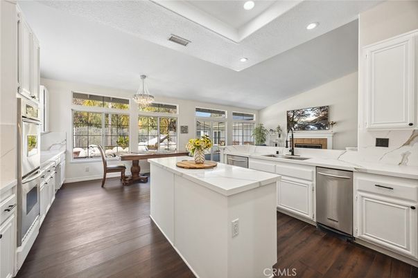 Chandelier, Dining room, Fireplace, Interior, Kitchen, Recessed Lighting, Stainless Steel Appliances, Wood Texture Flooring