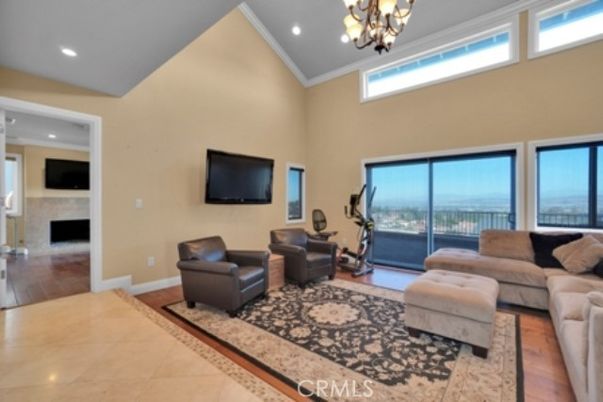 Chandelier, Fireplace, Fitness Equipment, Interior, Living room, Recessed Lighting, Wood Texture Flooring