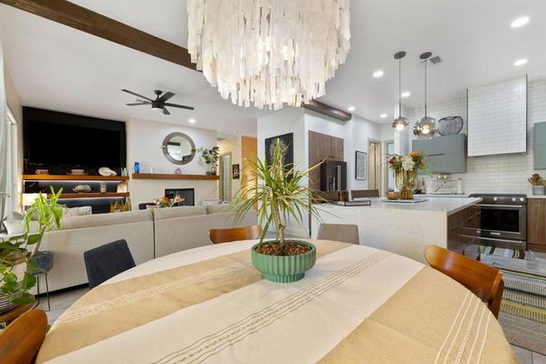 Chandelier, Dining room, Fireplace, Interior, Kitchen, Living room, Pendant Lights, Recessed Lighting, Stainless Steel Appliances