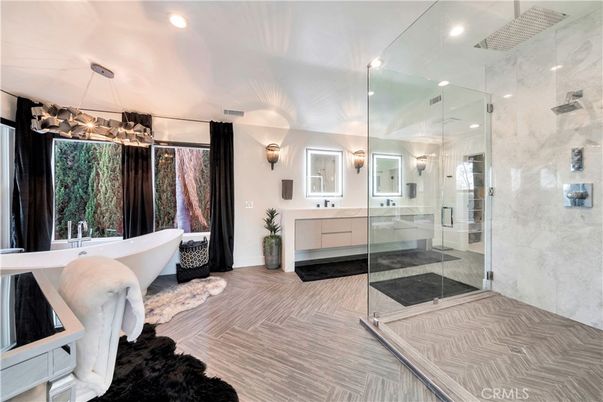 Bathroom, Free Standing Baths, Glass Shower, Interior, Marble Walls, Pendant Lights, Recessed Lighting, Wood Texture Flooring