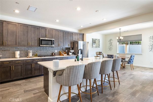Dining room, Interior, Kitchen, Pendant Lights, Recessed Lighting, Stainless Steel Appliances, Wood Texture Flooring