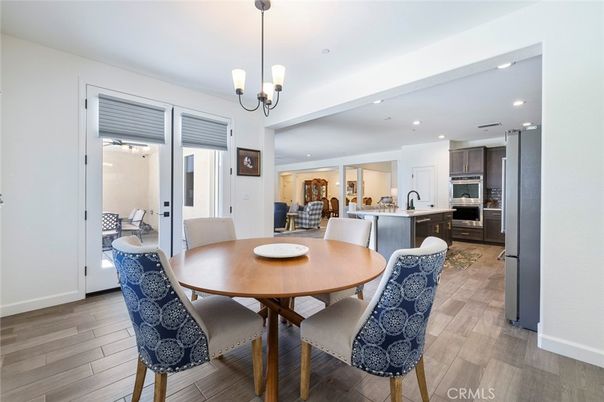 Dining room, Interior, Kitchen, Pendant Lights, Recessed Lighting, Stainless Steel Appliances, Wood Texture Flooring