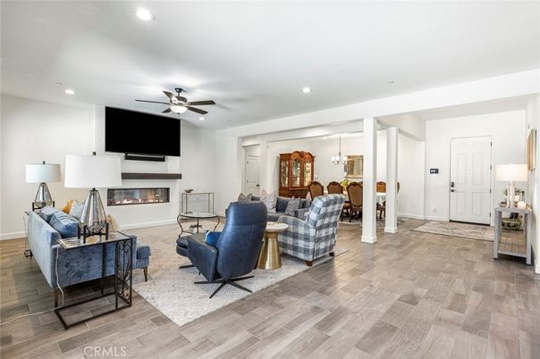 Dining room, Fireplace, Interior, Living room, Pendant Lights, Recessed Lighting, Wood Texture Flooring