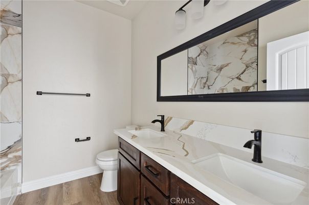 Bathroom, Dual Sink Vanities, Interior, Marble Walls, Wood Texture Flooring