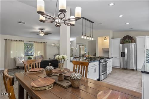 Chandelier, Dining room, Interior, Kitchen, Pendant Lights, Recessed Lighting, Stainless Steel Appliances, Wood Texture Flooring