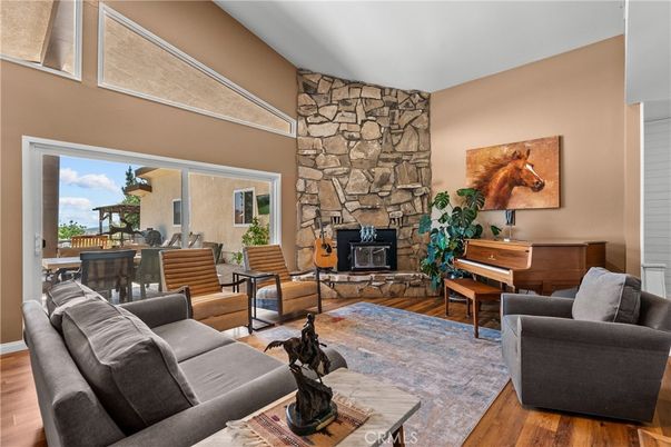 Dining room, Fireplace, Interior, Living room, Piano, Stone Walls, Wood Texture Flooring