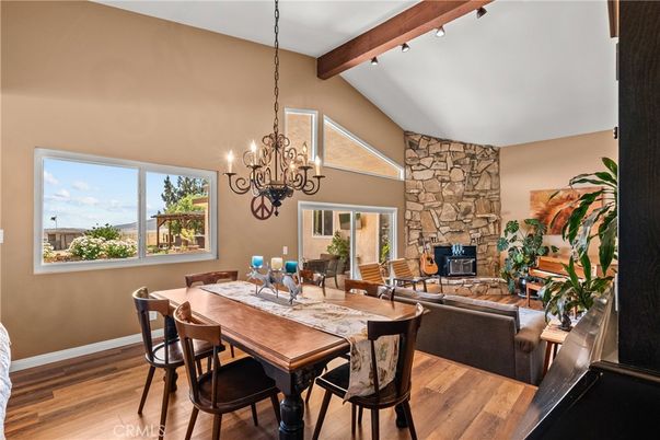 Chandelier, Dining room, Fireplace, Interior, Pendant Lights, Stone Walls, Wooden Beams, Wood Texture Flooring