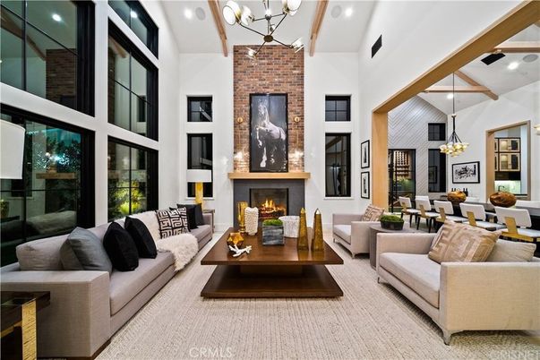 Chandelier, Dining room, Fireplace, Interior, Living room, Pendant Lights, Recessed Lighting, Stone Walls, Wooden Beams