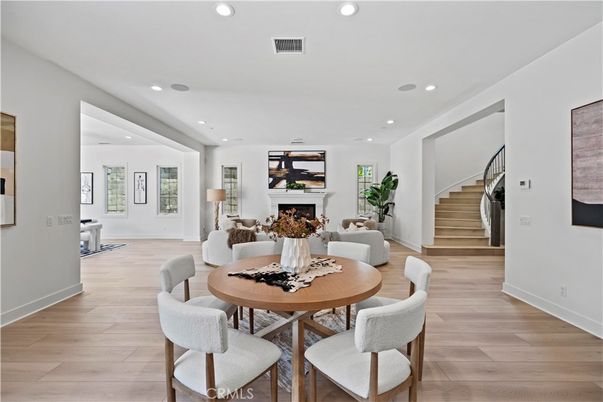 Dining room, Fireplace, Interior, Living room, Recessed Lighting, Wood Texture Flooring