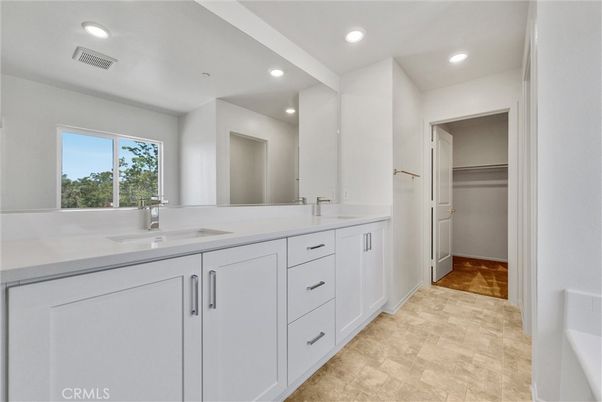 Bathroom, Dual Sink Vanities, Interior, Recessed Lighting, Walk-in Closets, Wood Texture Flooring