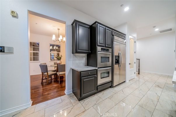 Chandelier, Dining room, Interior, Kitchen, Pendant Lights, Recessed Lighting, Stainless Steel Appliances, Wood Texture Flooring