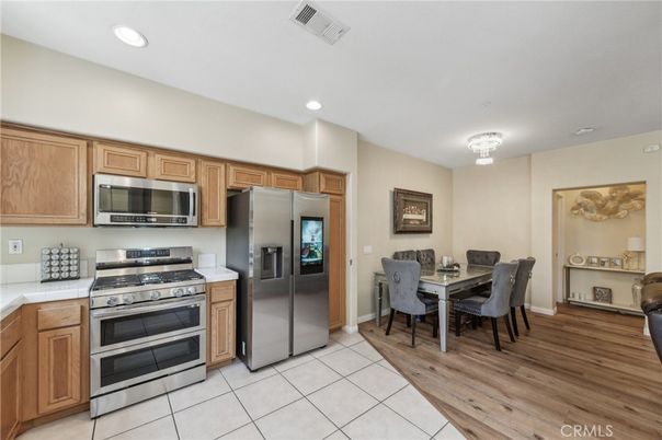 Chandelier, Dining room, Interior, Kitchen, Recessed Lighting, Stainless Steel Appliances, Wood Texture Flooring