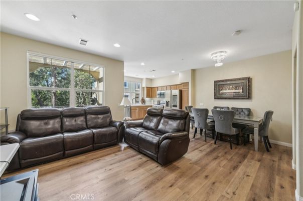 Chandelier, Dining room, Interior, Kitchen, Living room, Recessed Lighting, Stainless Steel Appliances, Wood Texture Flooring