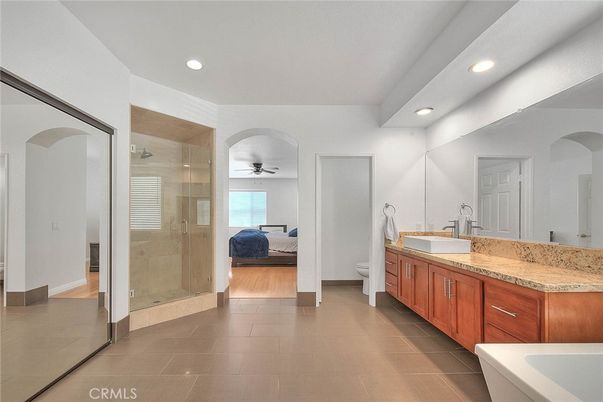 Bathroom, Bedroom, Dual Sink Vanities, Glass Shower, Interior, Recessed Lighting, Wood Texture Flooring