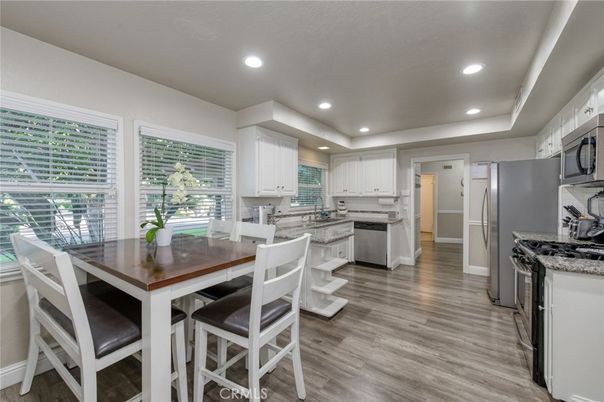 Dining room, Interior, Kitchen, Recessed Lighting, Stainless Steel Appliances, Wood Texture Flooring