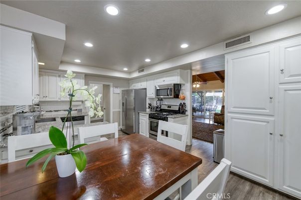 Dining room, Interior, Kitchen, Recessed Lighting, Stainless Steel Appliances, Wood Texture Flooring