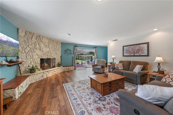 Fireplace, Interior, Living room, Recessed Lighting, Stone Walls, Wood Texture Flooring