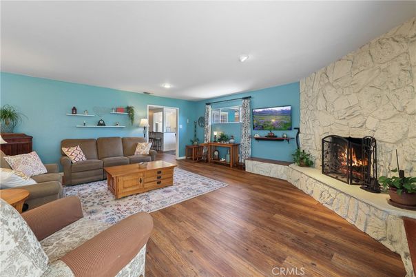 Fireplace, Interior, Living room, Recessed Lighting, Stone Walls, Wood Texture Flooring