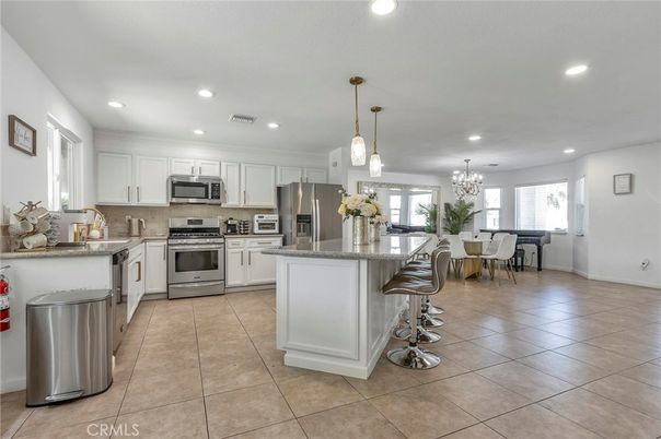 Chandelier, Dining room, Interior, Kitchen, Pendant Lights, Recessed Lighting, Stainless Steel Appliances