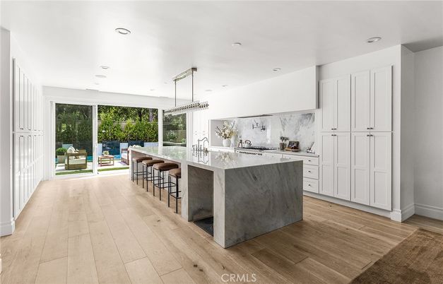 Interior, Kitchen, Marble Walls, Pendant Lights, Recessed Lighting, Wood Texture Flooring