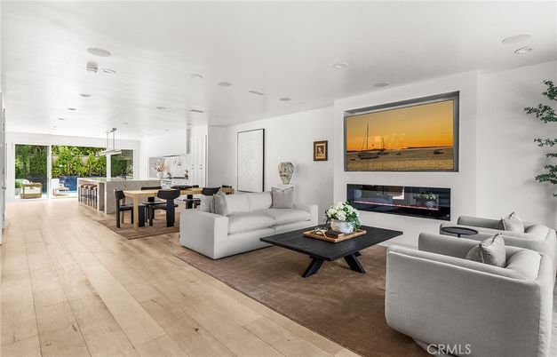Dining room, Fireplace, Interior, Living room, Pendant Lights, Recessed Lighting, Wood Texture Flooring