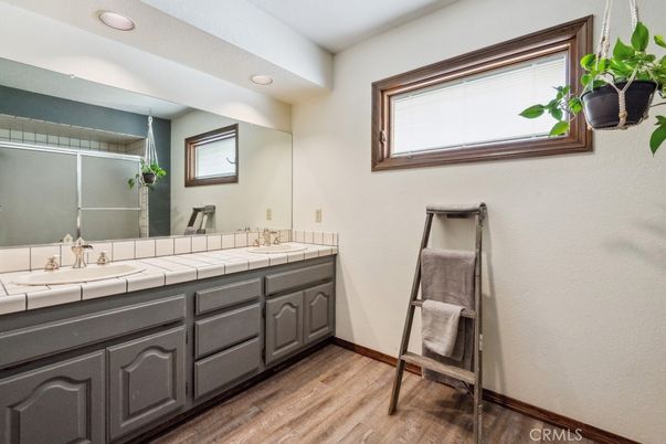 Bathroom, Dual Sink Vanities, Interior, Recessed Lighting, Tile Countertops, Wood Texture Flooring