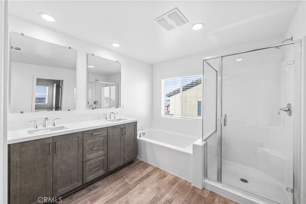 Bathroom, Dual Sink Vanities, Glass Shower, Interior, Recessed Lighting, Wood Texture Flooring
