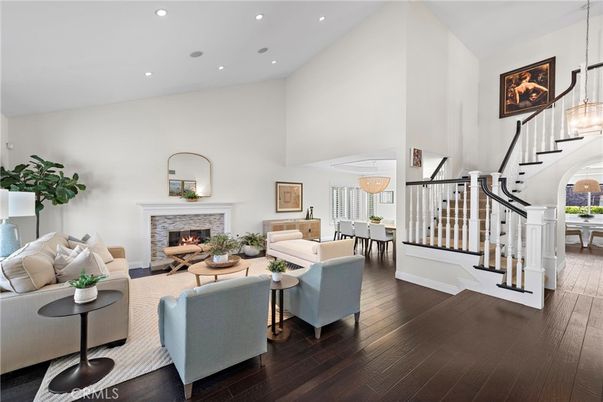 Dining room, Fireplace, Interior, Living room, Pendant Lights, Recessed Lighting, Wood Texture Flooring