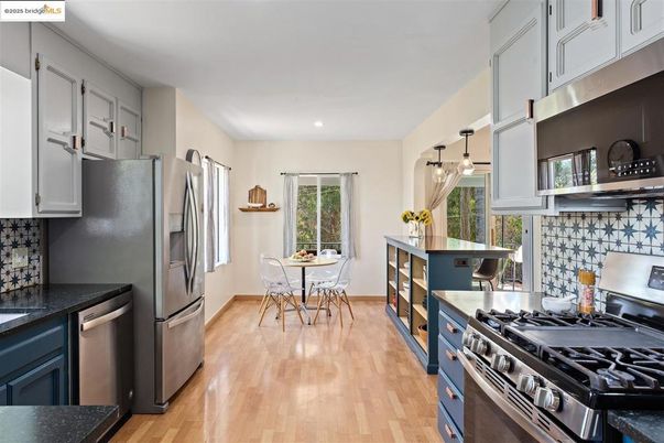 Dining room, Interior, Kitchen, Pendant Lights, Recessed Lighting, Stainless Steel Appliances, Wood Texture Flooring