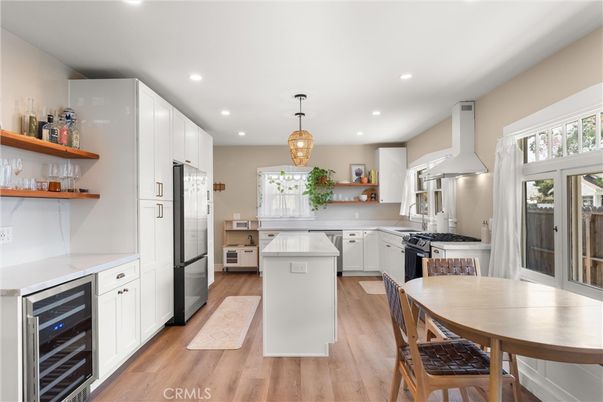 Dining room, Interior, Kitchen, Pendant Lights, Recessed Lighting, Stainless Steel Appliances, Wood Texture Flooring