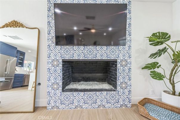 Fireplace, Interior, Kitchen, Recessed Lighting, Stainless Steel Appliances, Wood Texture Flooring