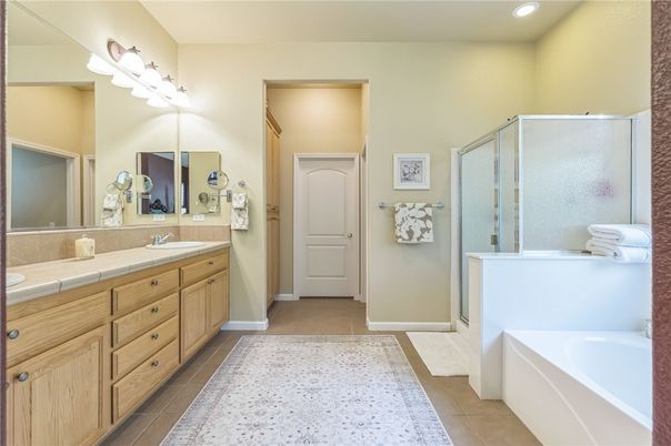 Bathroom, Dual Sink Vanities, Glass Shower, Interior, Recessed Lighting, Tile Countertops