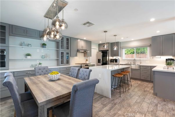 Dining room, Interior, Kitchen, Pendant Lights, Recessed Lighting, Stainless Steel Appliances, Wood Texture Flooring
