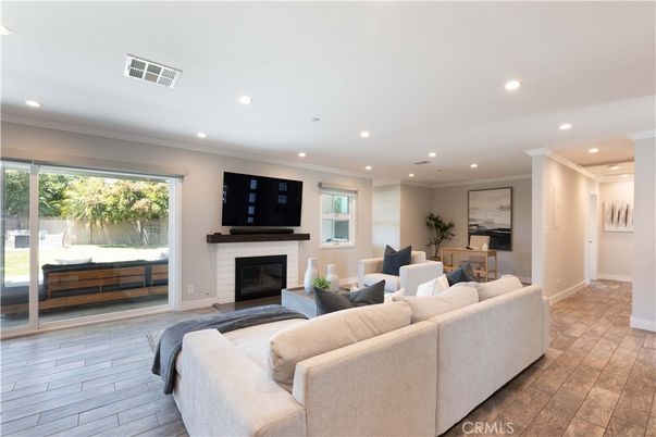 Dining room, Fireplace, Interior, Living room, Recessed Lighting, Wood Texture Flooring